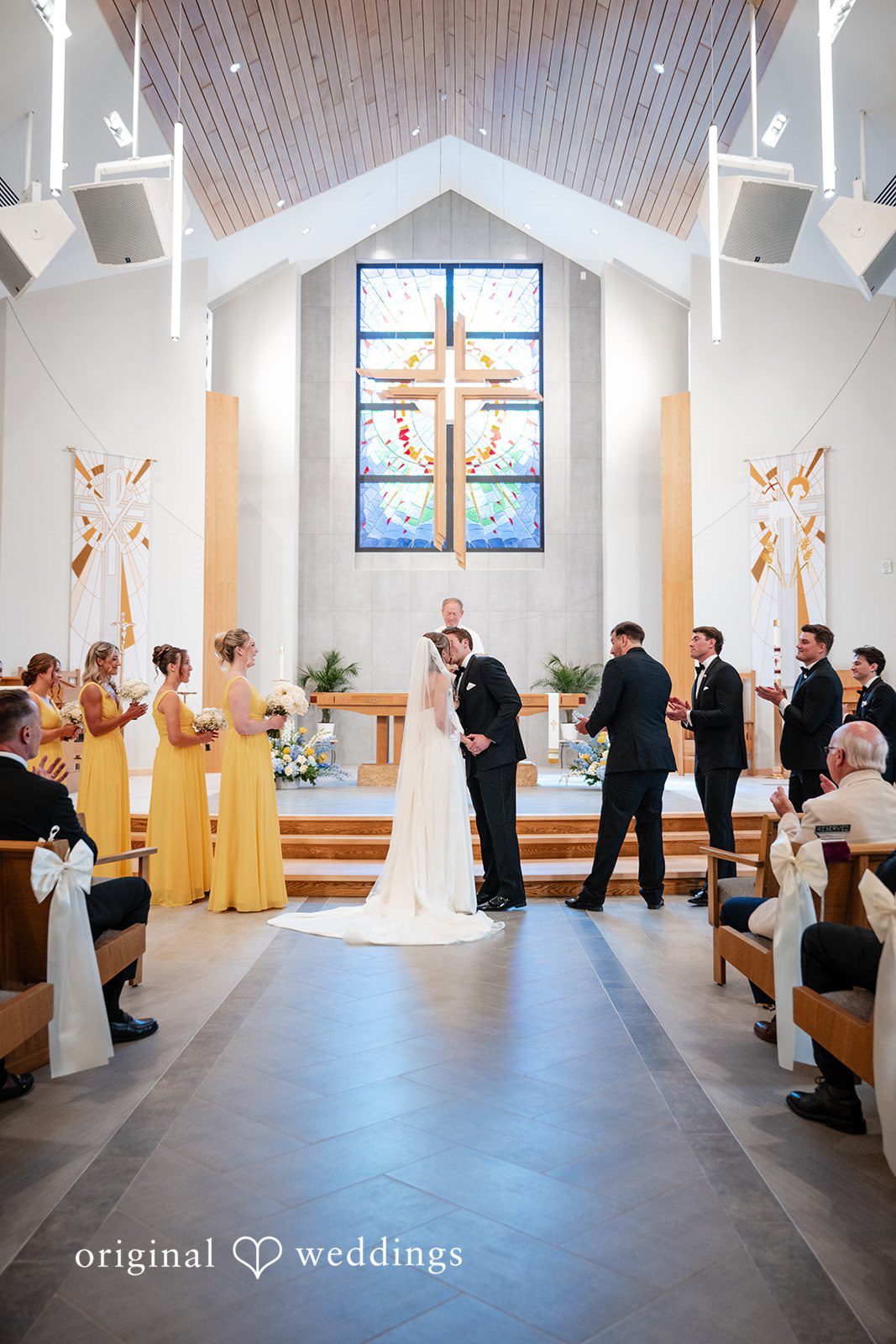 Brandi + Ryan Couple sharing a romantic kiss at Christ the Lord Lutheran Church