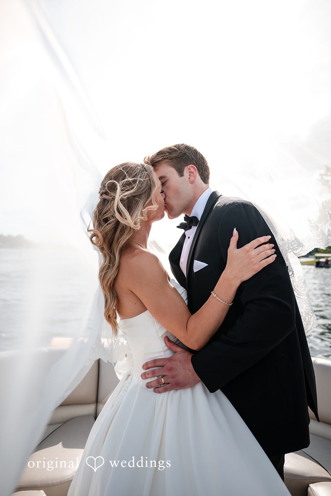 Brandi + Ryan Bride and groom sharing a romantic kiss at Christ the Lord Lutheran Church