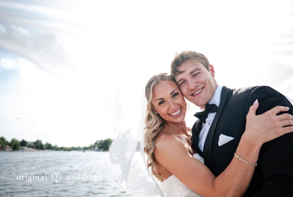 Brandi + Ryan Bride and groom smiling together at Christ the Lord Lutheran Church captured by Milwaukee Wedding Photographers from Original Weddings.