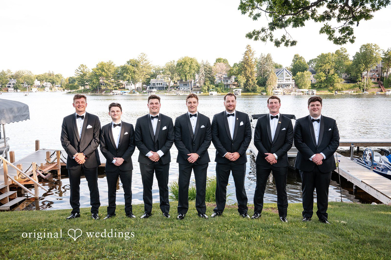 Brandi + Ryan Groom smiling with the groomsmen before the ceremony at Christ the Lord Lutheran Church.