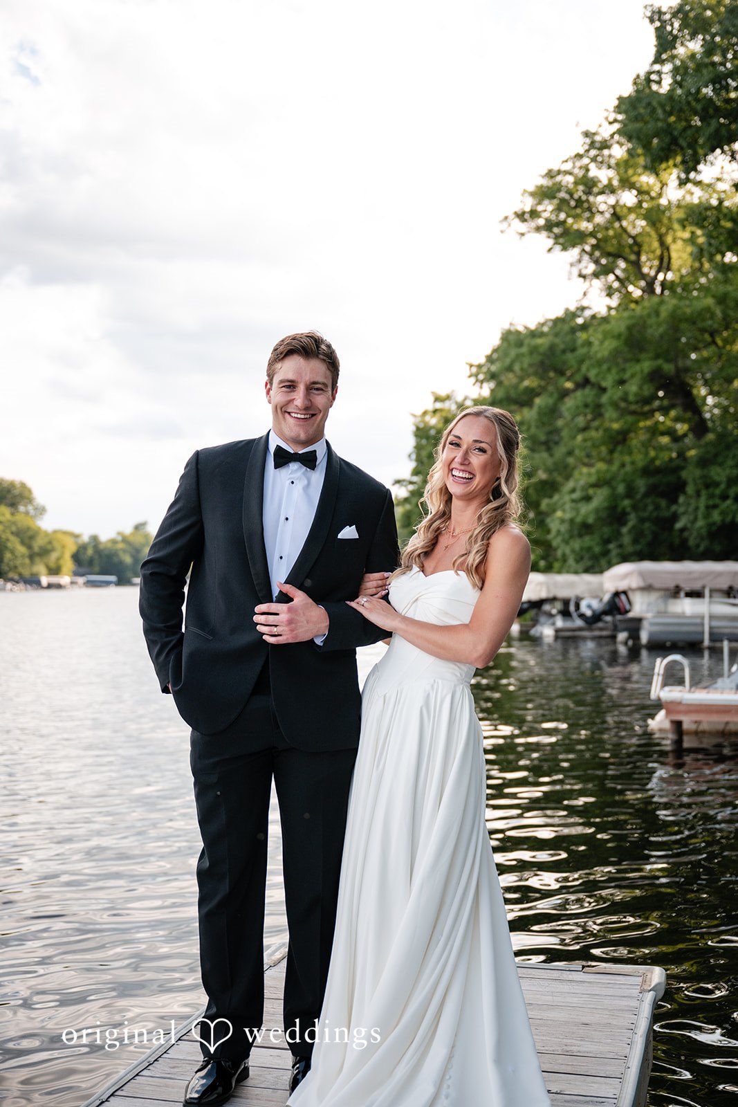 Brandi + Ryan Bride and groom laughing together at Christ the Lord Lutheran Church