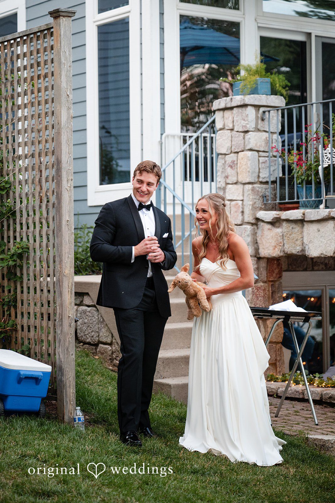 Brandi + Ryan Bride and groom laughing together at Christ the Lord Lutheran Church