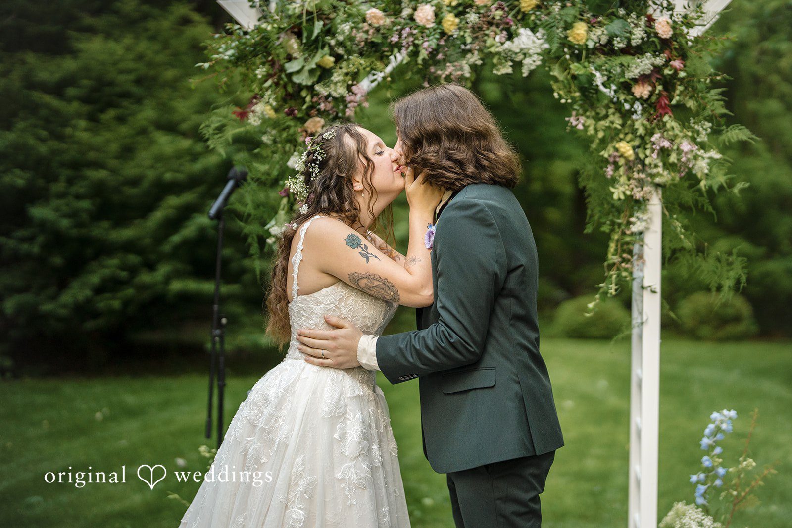 Meghan + Rowan A close-up shot of a bride and groom kissing each other after wedding ceremony.