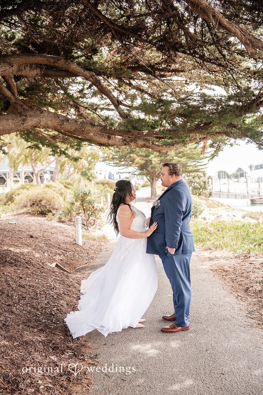 Thuy + Ryan Romantic wedding portrait after the ceremony at Double Tree by Hilton Hotel Berkeley captured by San Francisco Wedding Photographers from Original Weddings