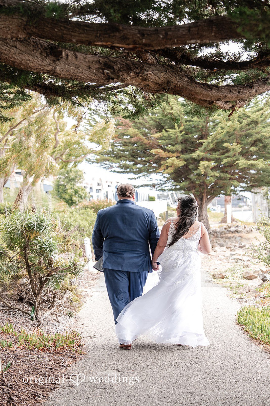 Thuy + Ryan Newlyweds enjoying their first walk together at Double Tree by Hilton Hotel Berkeley