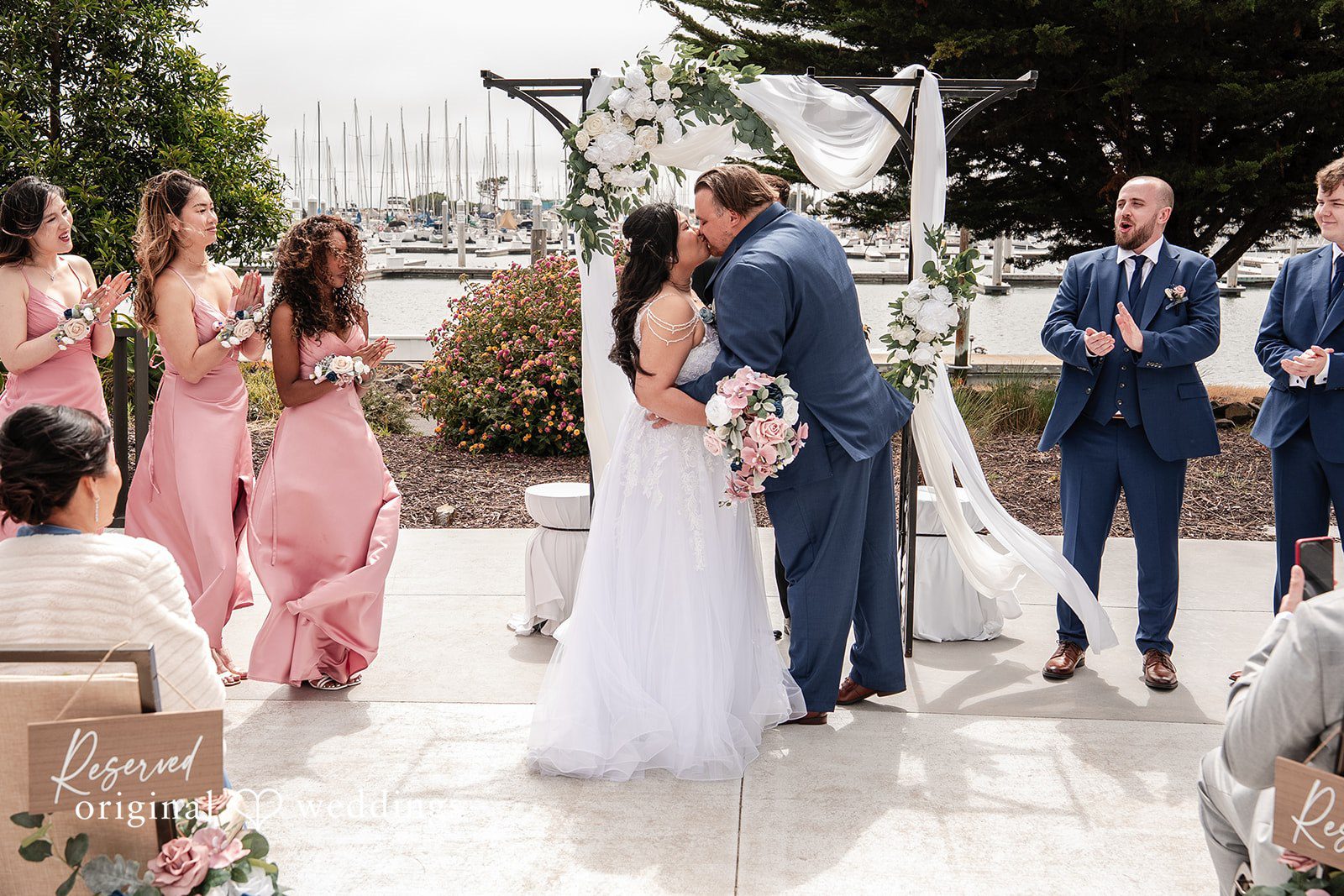 Thuy + Ryan Couple sharing a romantic kiss at Double Tree by Hilton Hotel Berkeley