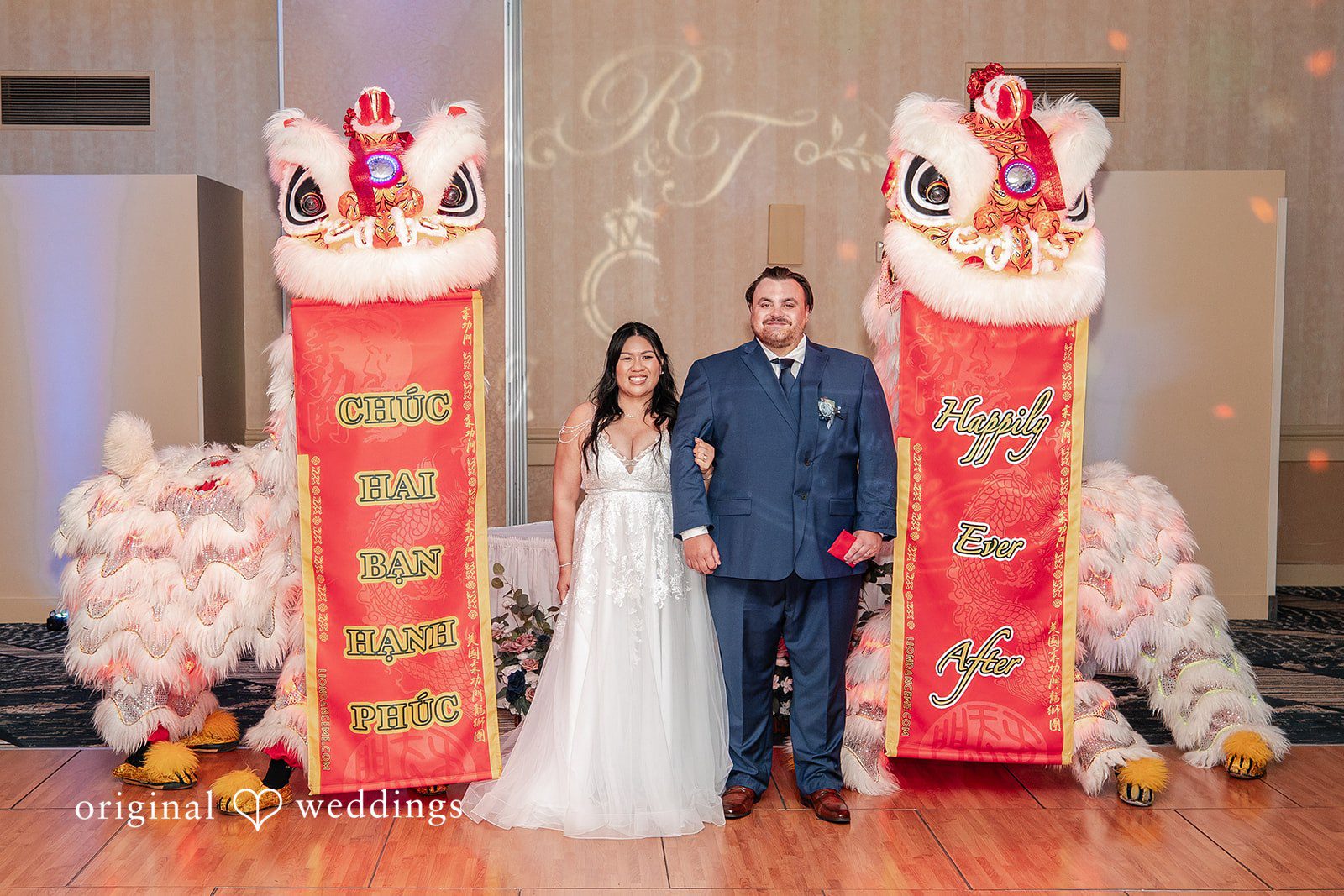 Thuy + Ryan San Francisco Wedding Photographers at Double Tree by Hilton Hotel Berkeley by Original Weddings capturing the couple with lion dancers.