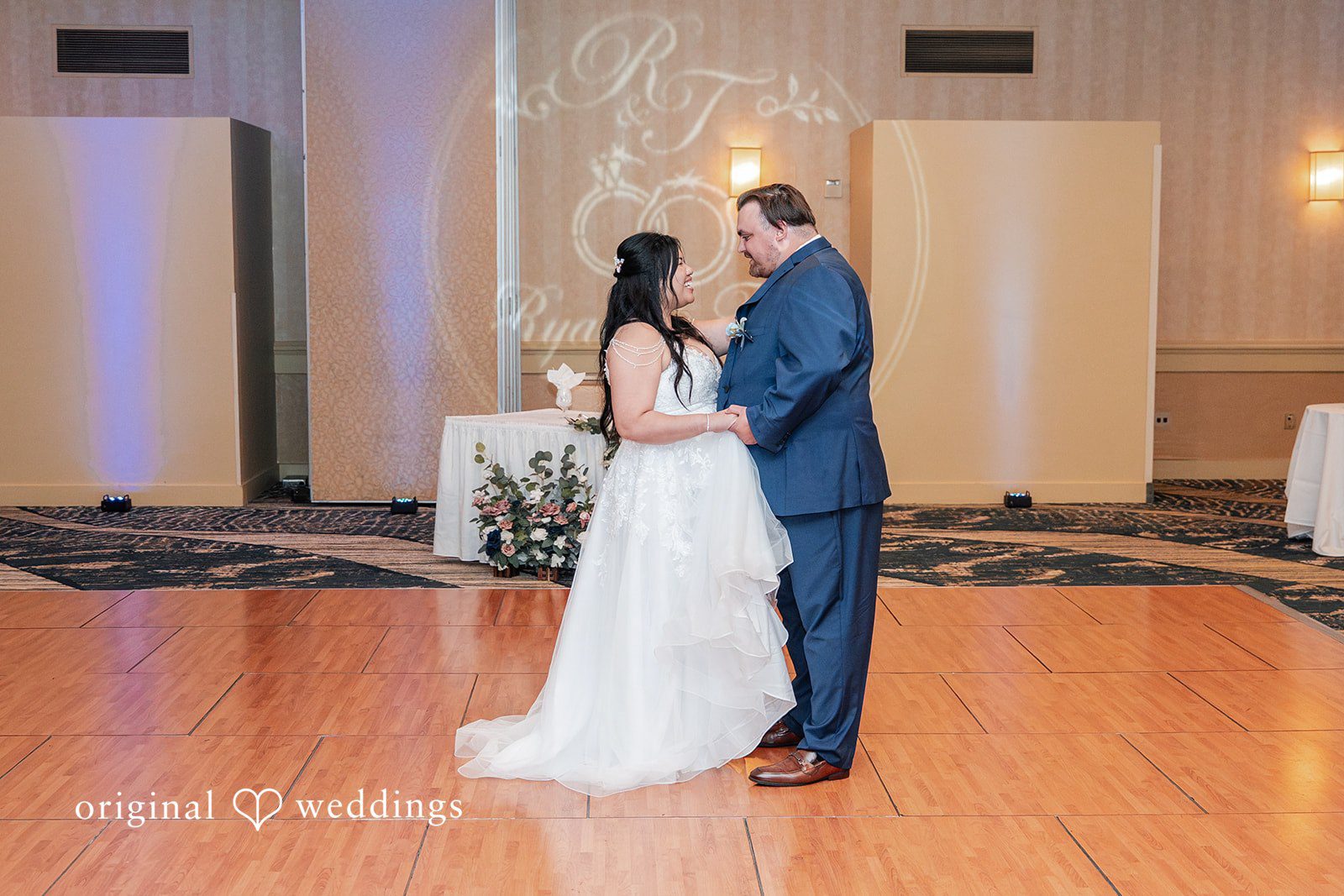 Thuy + Ryan Bride and groom enjoying a dance together at Double Tree by Hilton Hotel Berkeley