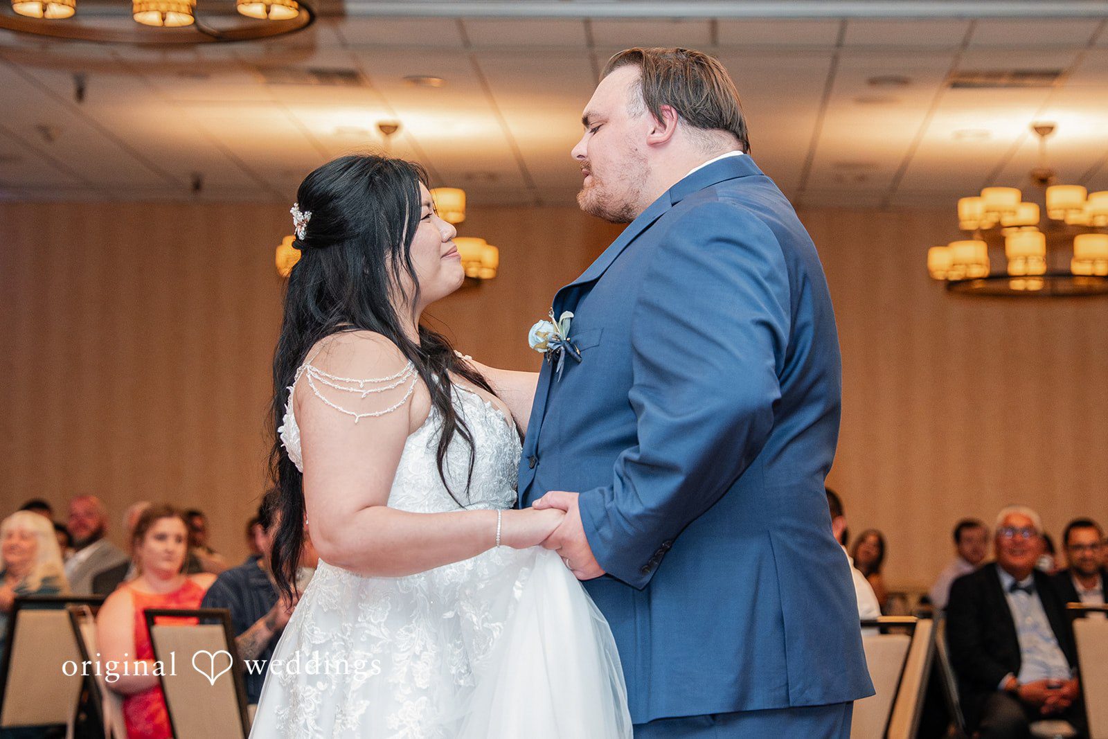 Thuy + Ryan Couple looking at each other while dancing at Double Tree by Hilton Hotel Berkeley captured by San Francisco Wedding Photographers from Original Weddings