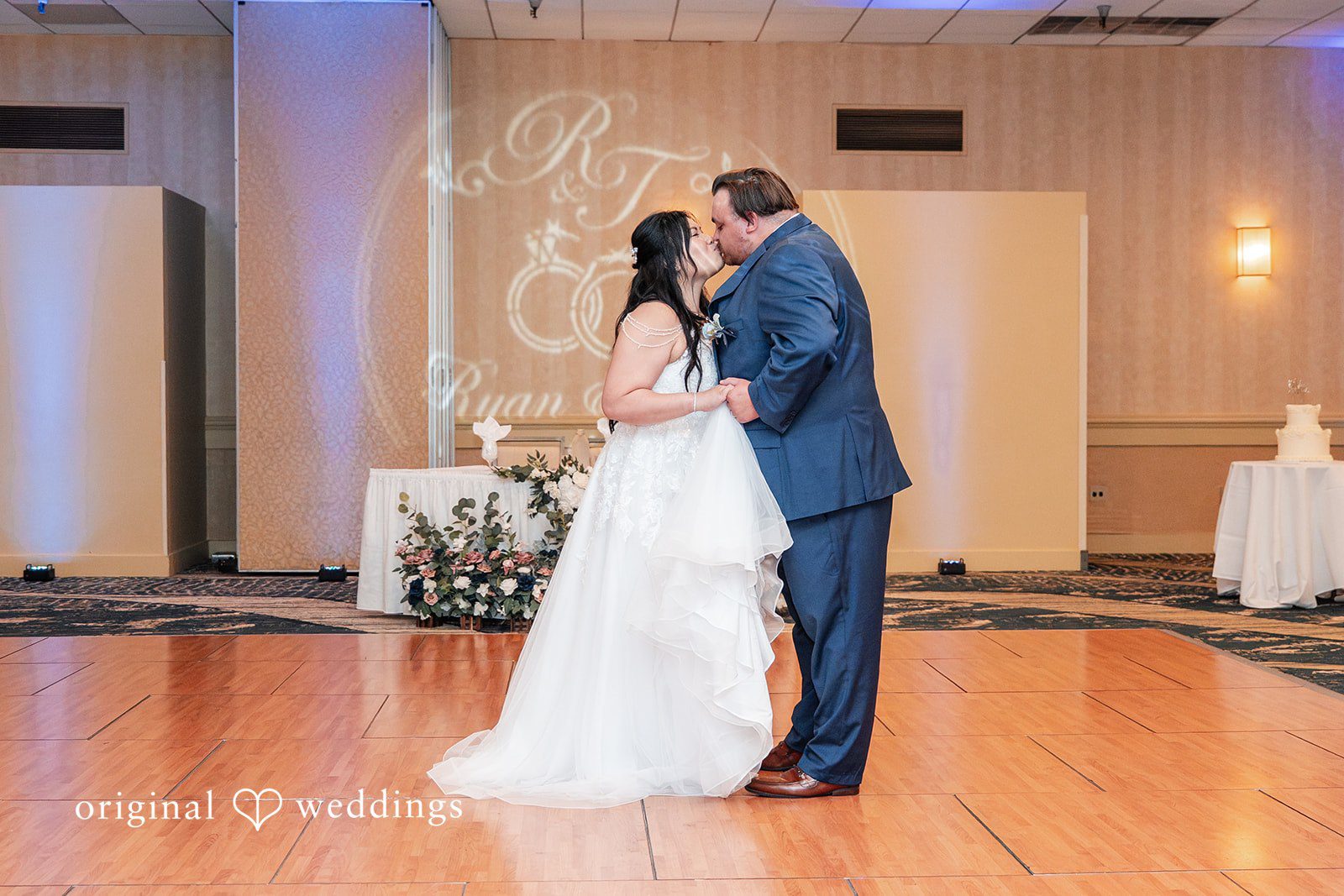 Thuy + Ryan Bride and groom sharing a romantic kiss at Double Tree by Hilton Hotel Berkeley