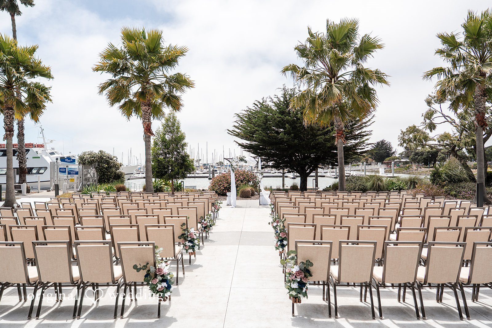 Thuy + Ryan Elegant ceremony setup and seating arranged for guests at Double Tree by Hilton Hotel Berkeley