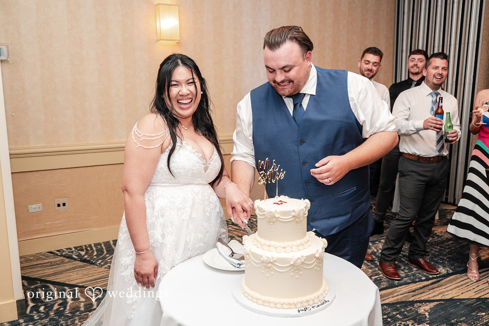 Thuy + Ryan Happy couple sharing smiles during the cake-cutting ceremony at Double Tree by Hilton Hotel Berkeley