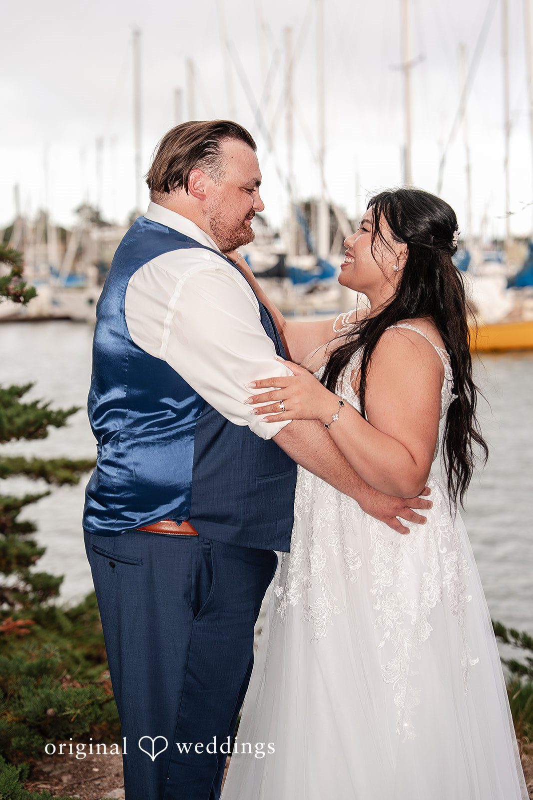 Thuy + Ryan Couple looking at each other with smiles at Double Tree by Hilton Hotel Berkeley