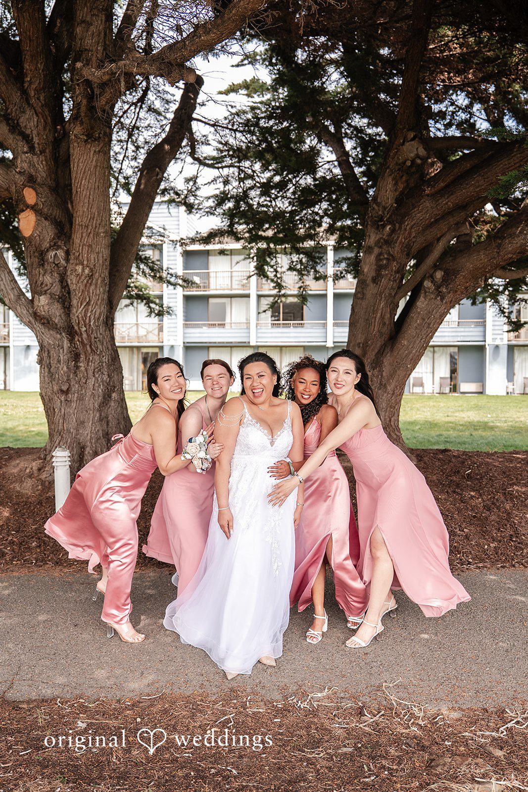 Thuy + Ryan Bride sharing smiles with her bridesmaids before the wedding