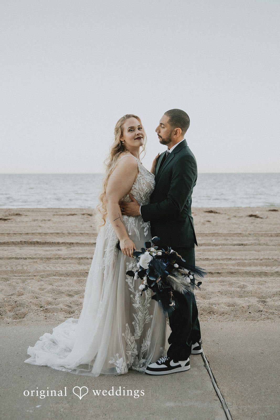 Allison + Justin Bride and groom smiling at the camera at DoubleTree by Hilton Corpus Christi Beachfront