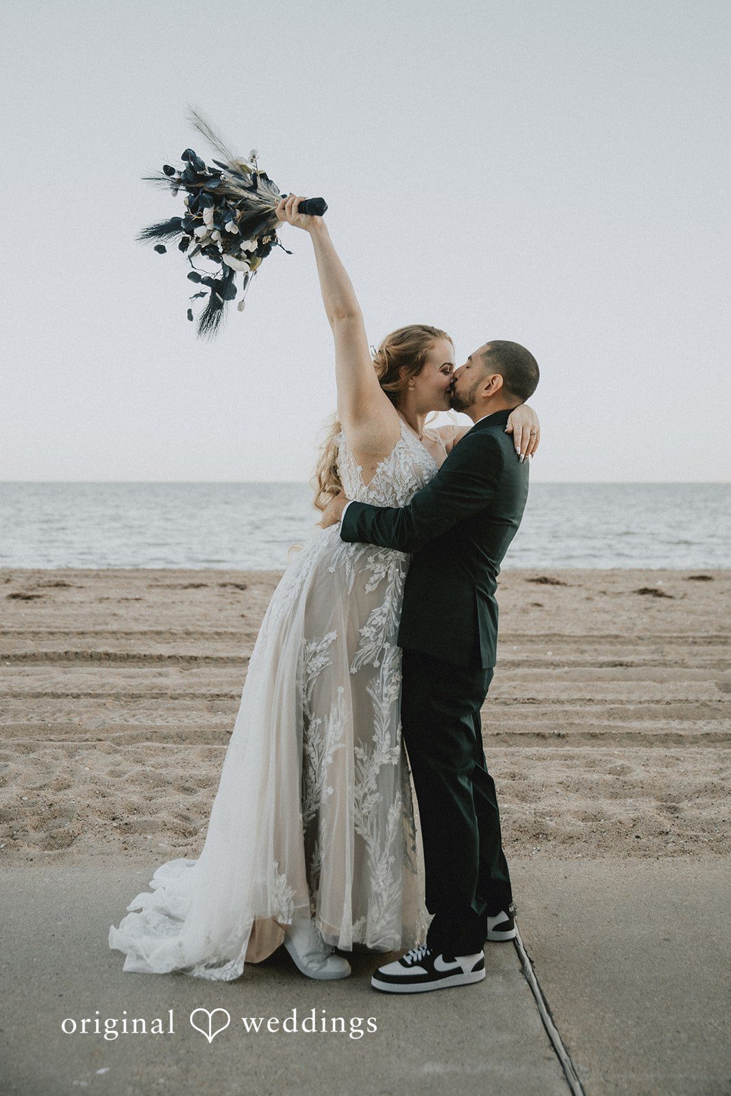 Allison + Justin Bride and groom sharing a kiss at DoubleTree by Hilton Corpus Christi Beachfront