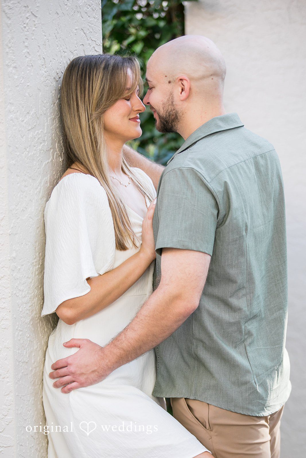 Lauren + Miles A couple embracing and smiling during their photoshoot.