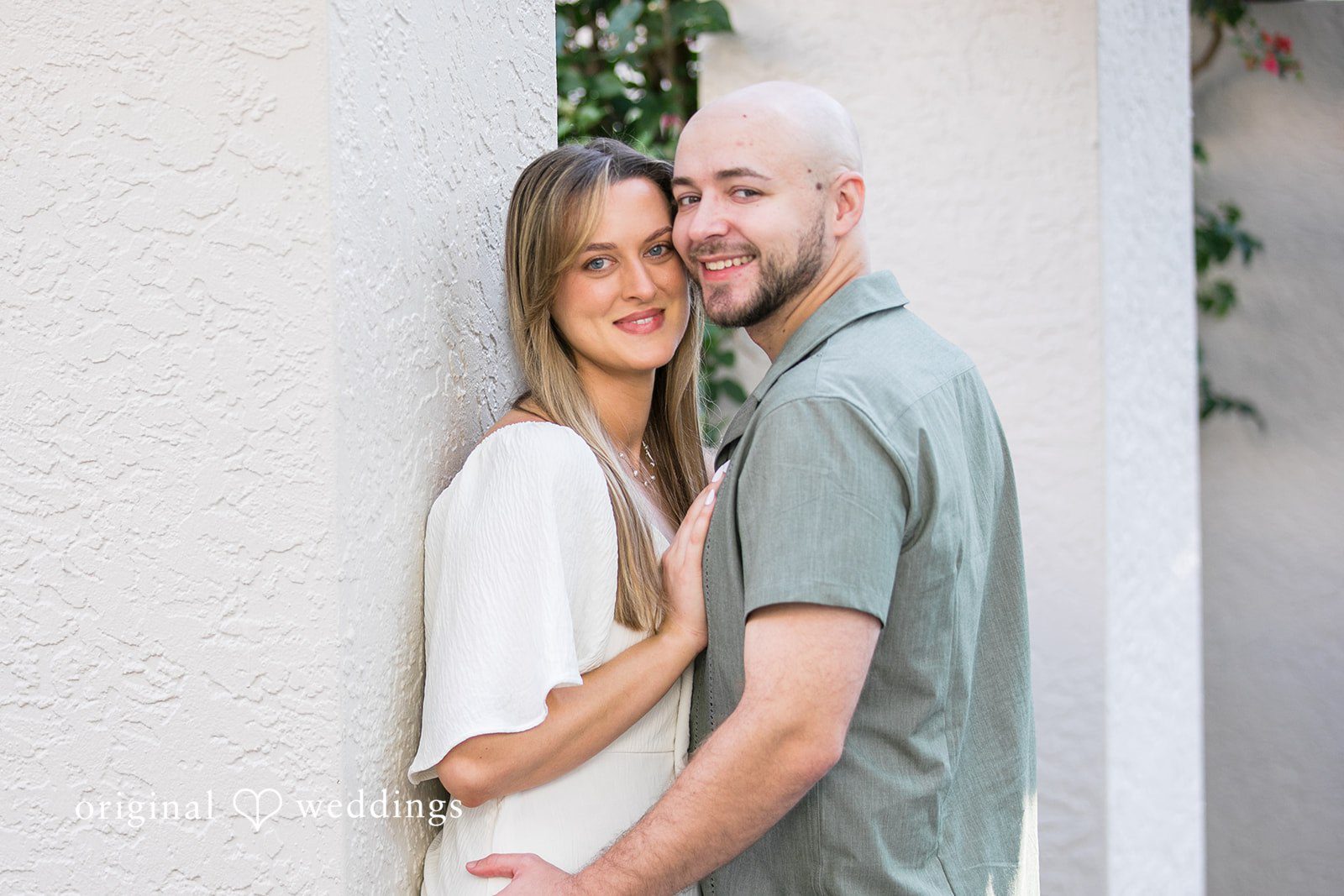 Lauren + Miles A couple holding each other and smiling for the camera.