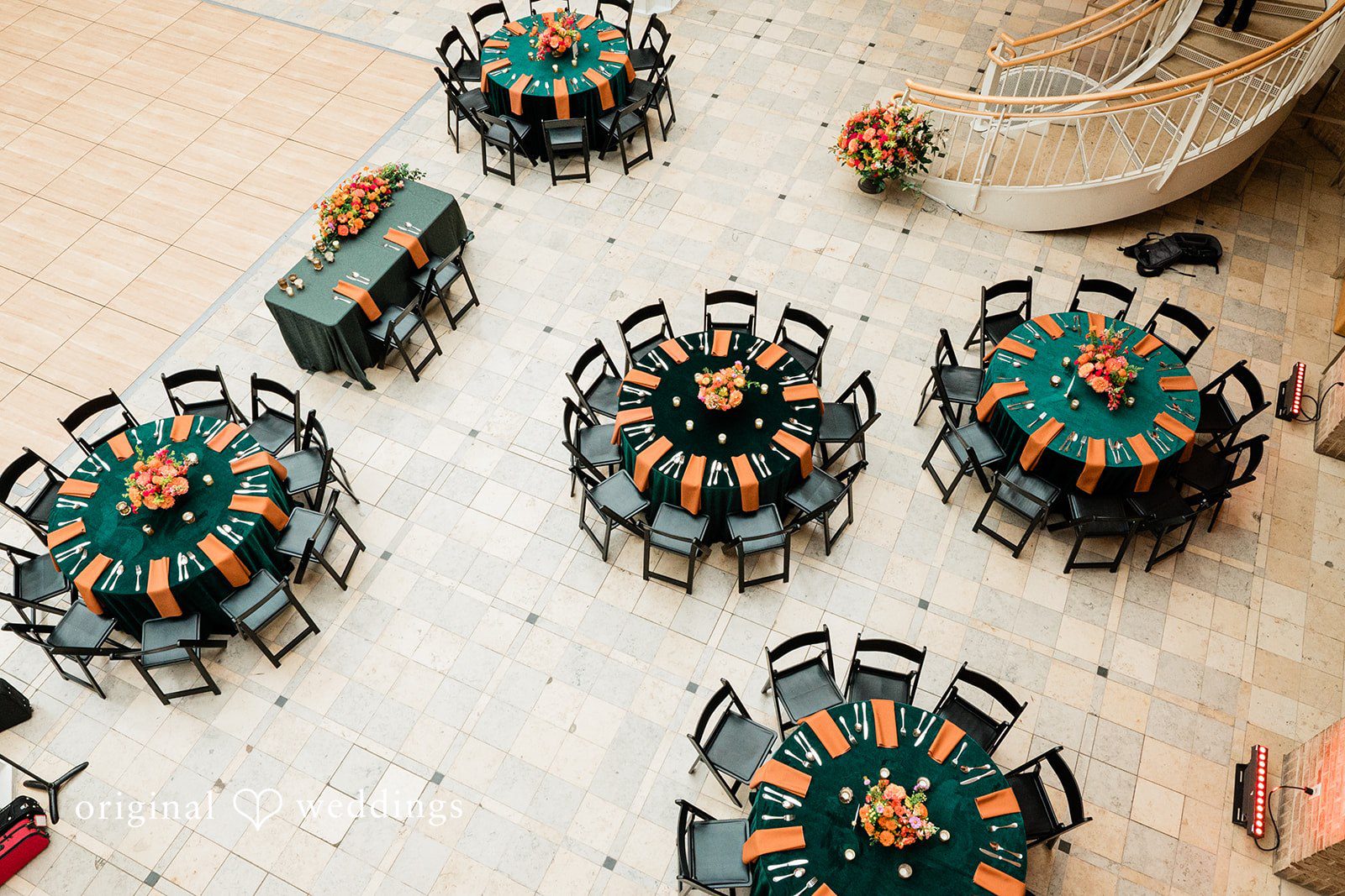 Sonya + Akshaya top-down bird's-eye view of an elegant banquet arrangement with circular tables and green accents.
