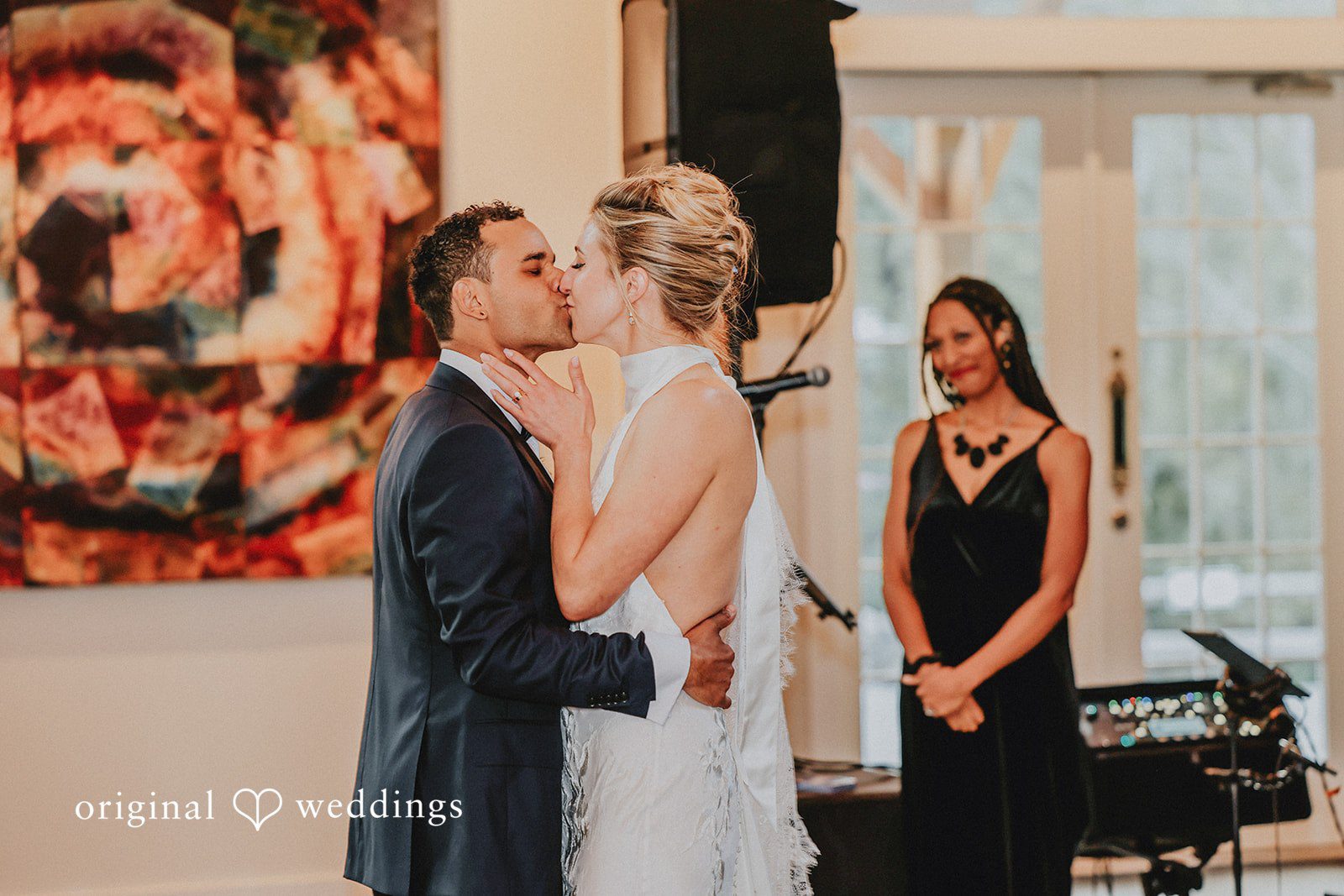 Bride and groom looking at each other closely during their reception.