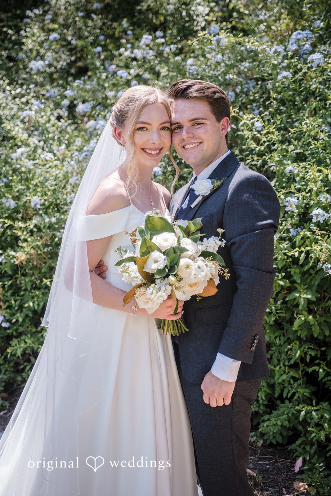 Madeline + Brady Elegant newlywed portrait showcasing genuine smiles and timeless wedding style