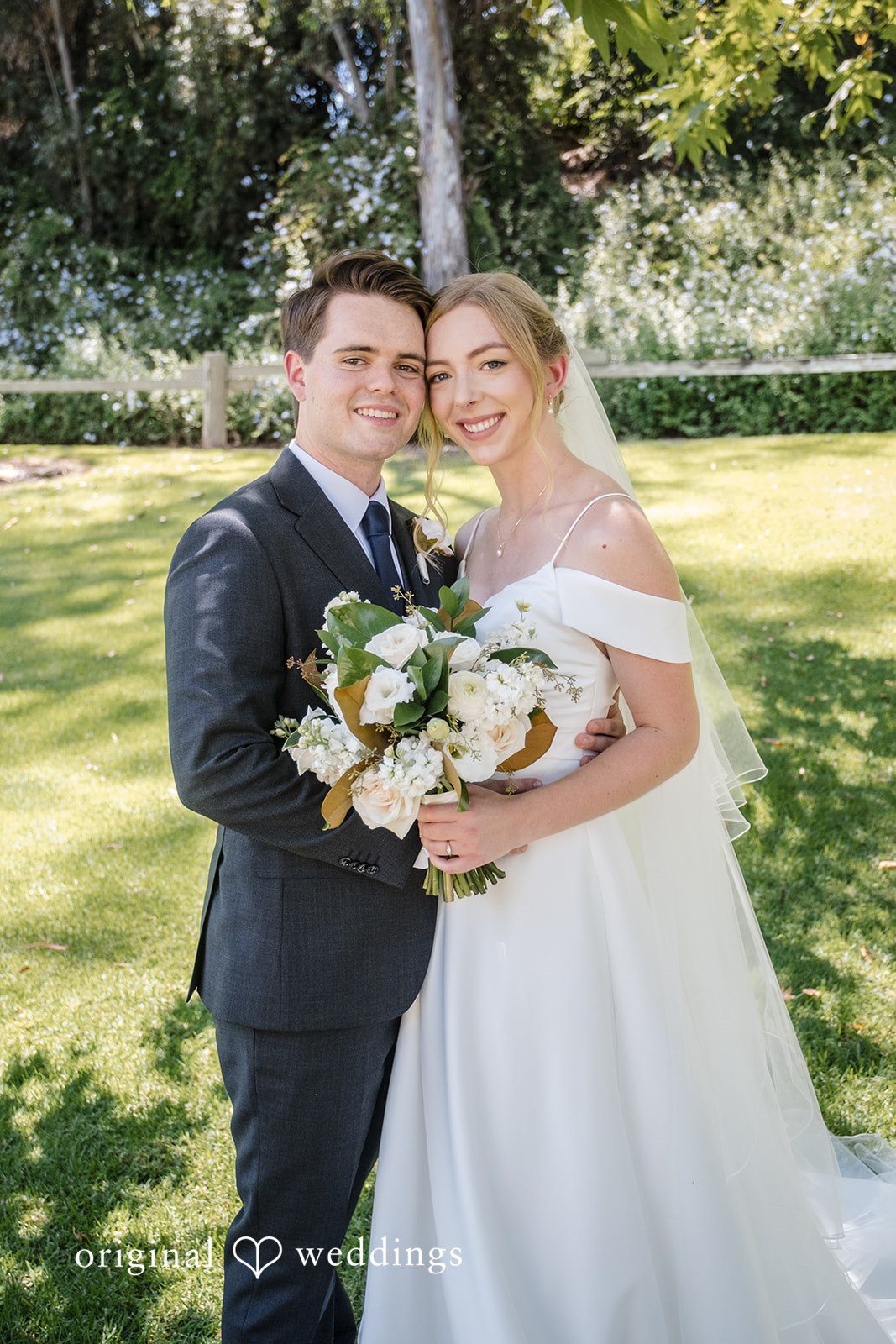 Madeline + Brady Romantic outdoor portrait of the happy newlyweds sharing smiles at Fullerton Community Center
