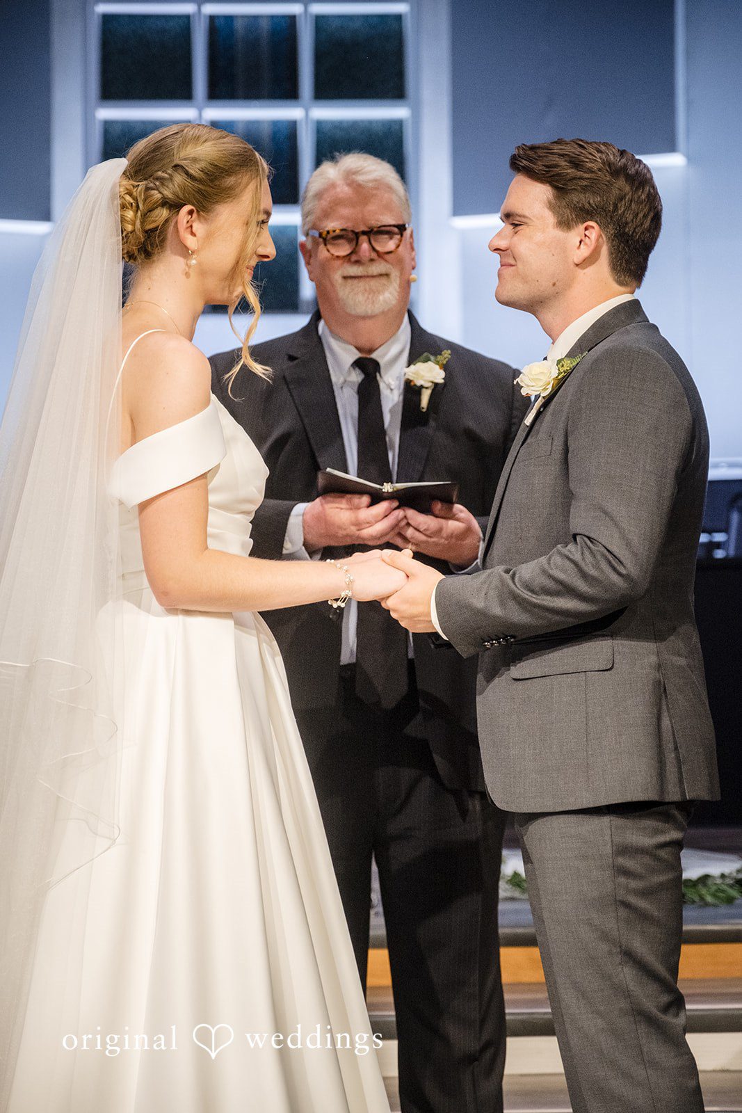 Madeline + Brady Bride and groom smiling lovingly at one another during their wedding day