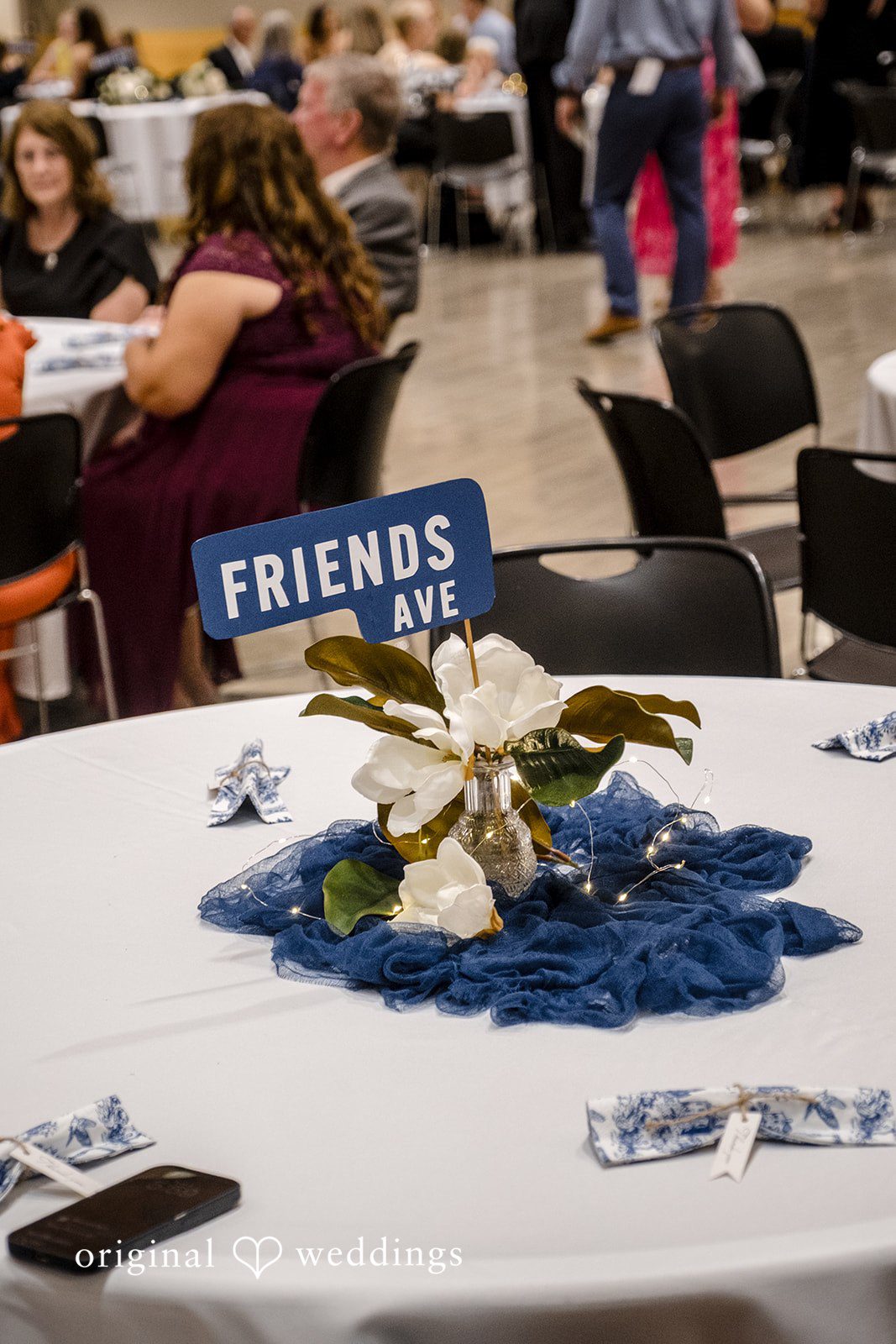 Madeline + Brady Elegant wedding reception table decorated with flowers, candles and stylish centrepiece details.