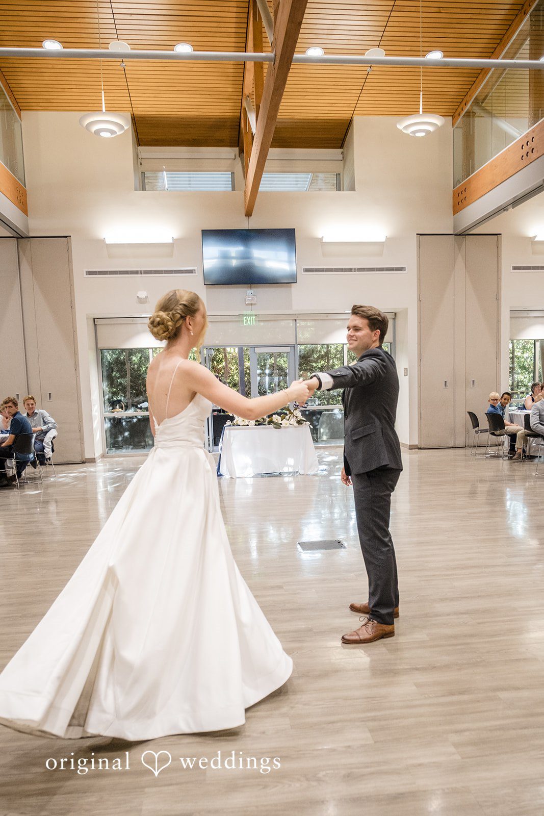 Madeline + Brady Bride and groom sharing their first dance at Fullerton Community Center captured by Los Angeles Wedding Photographers from Original Weddings.