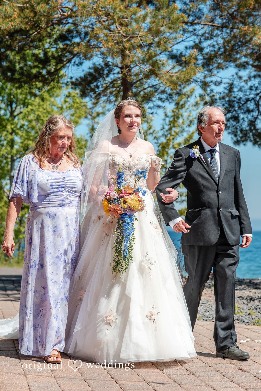 Nina + Steven Bride walking down the aisle with someone