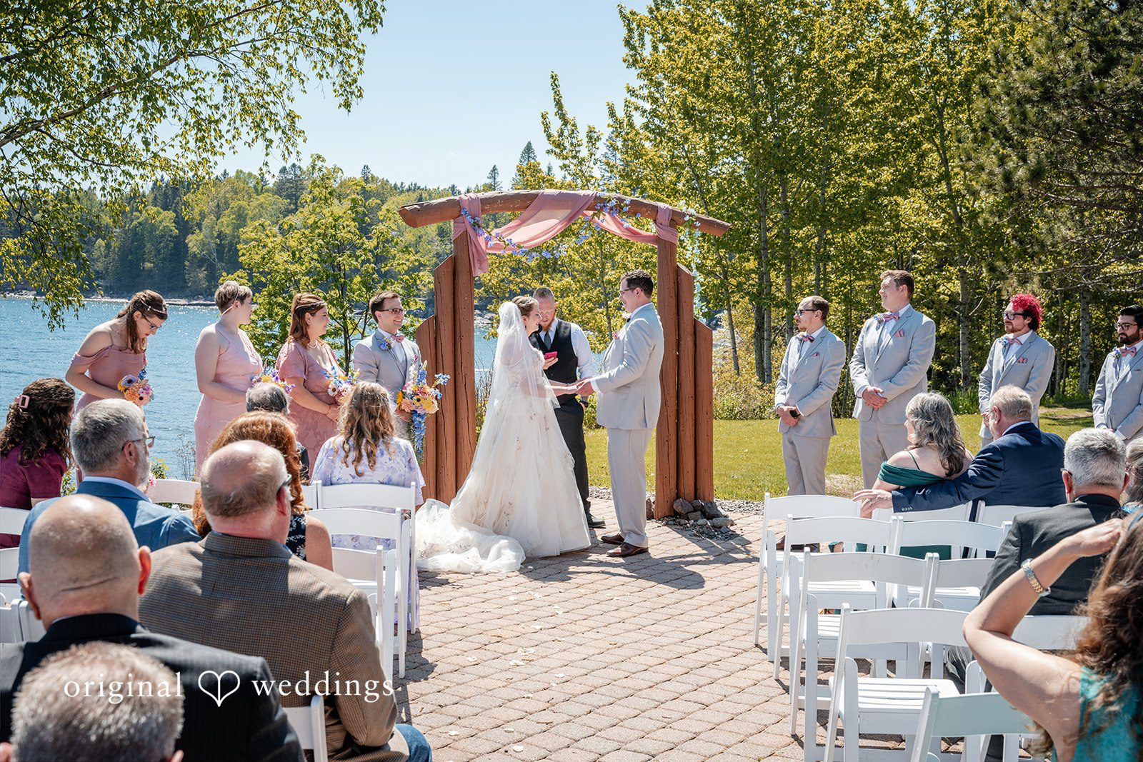 Nina + Steven Couple exchanging vows during the ceremony at Grand Superior Lodge