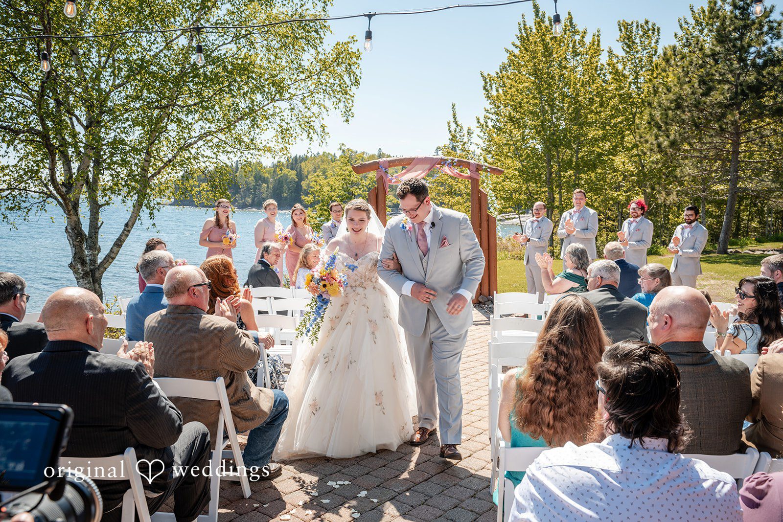 Nina + Steven Couple leaving the altar at Grand Superior Lodge captured by Minneapolis wedding photographers from Original Weddings