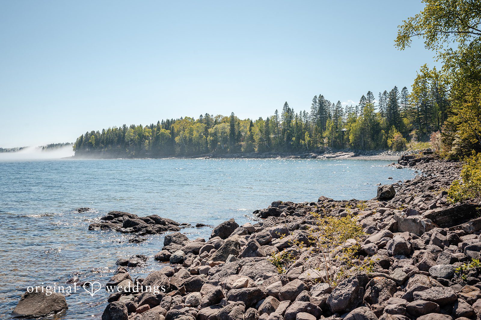 Nina + Steven Beautiful picture of water, stones and trees at Grand Superior Lodge