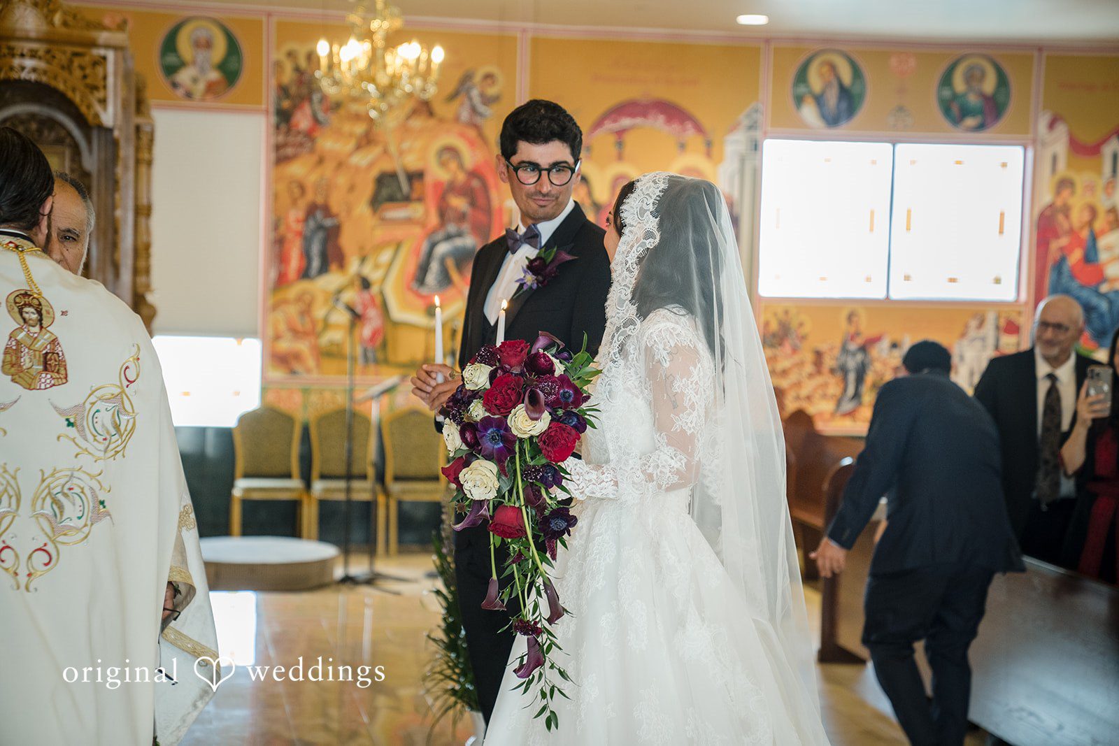 Janelle + Yaser Bride and groom looking towards each other with love and joy during wedding ceremony