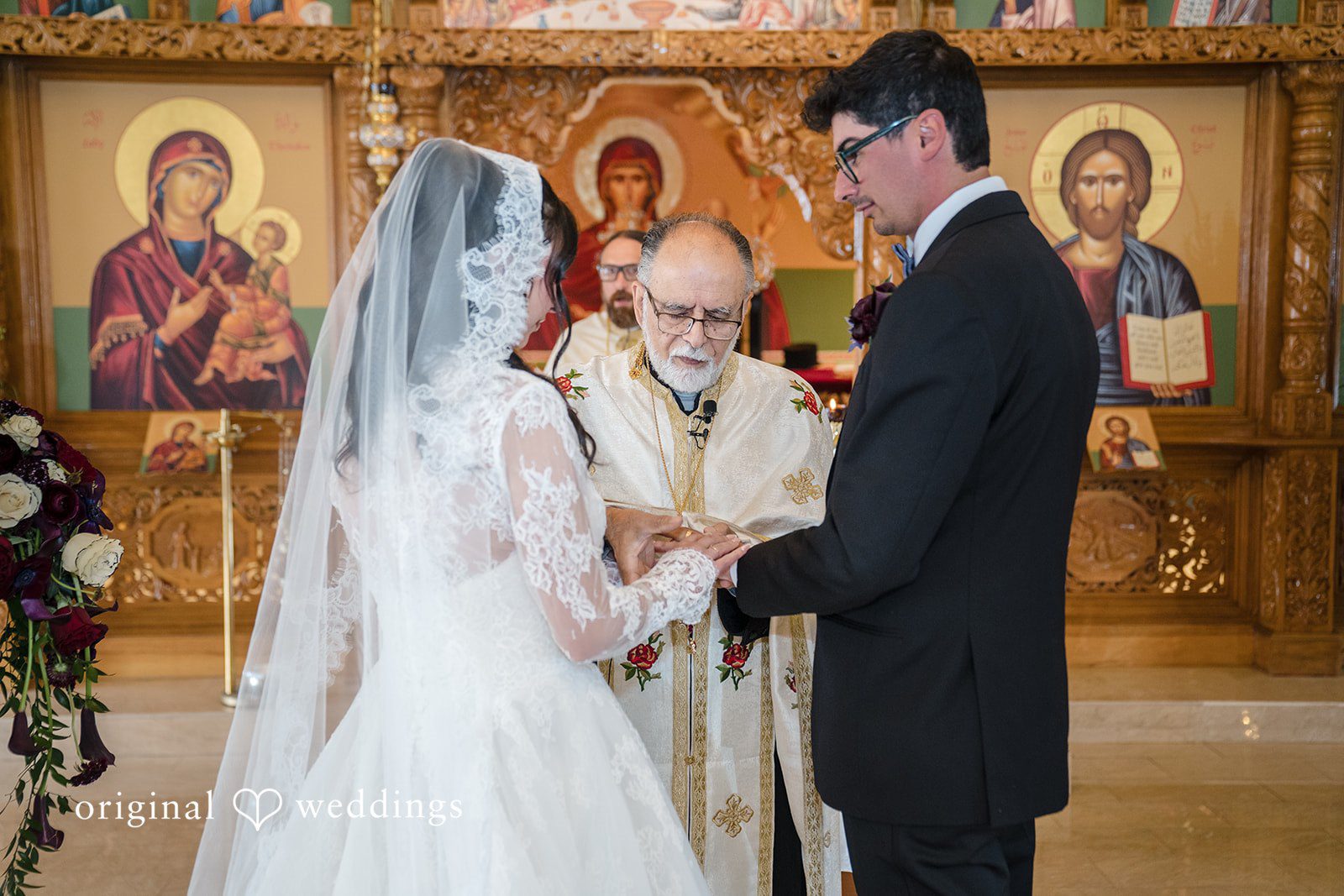 Janelle + Yaser Bride and groom exchanging wedding rings during the ceremony