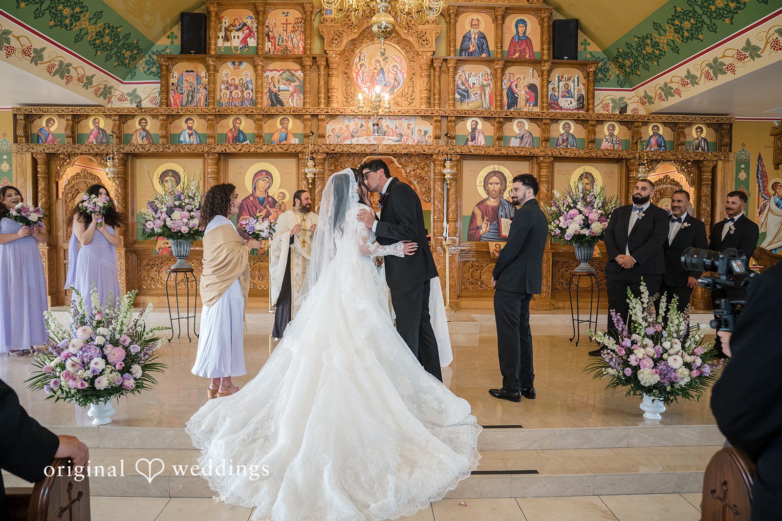 Janelle + Yaser Bride and groom sharing their first kiss after the wedding ceremony