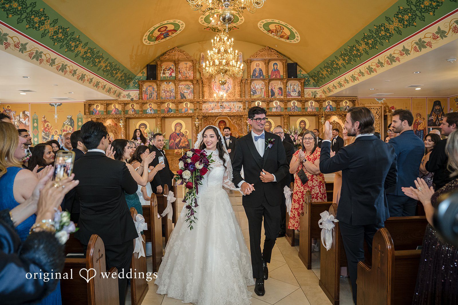 Janelle + Yaser Bride and groom leaving the altar with happiness while guests around
