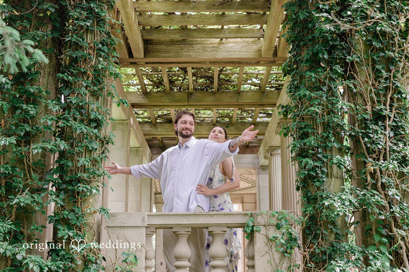 Bride holding the groom from behind during their engagement session at Harkness Park