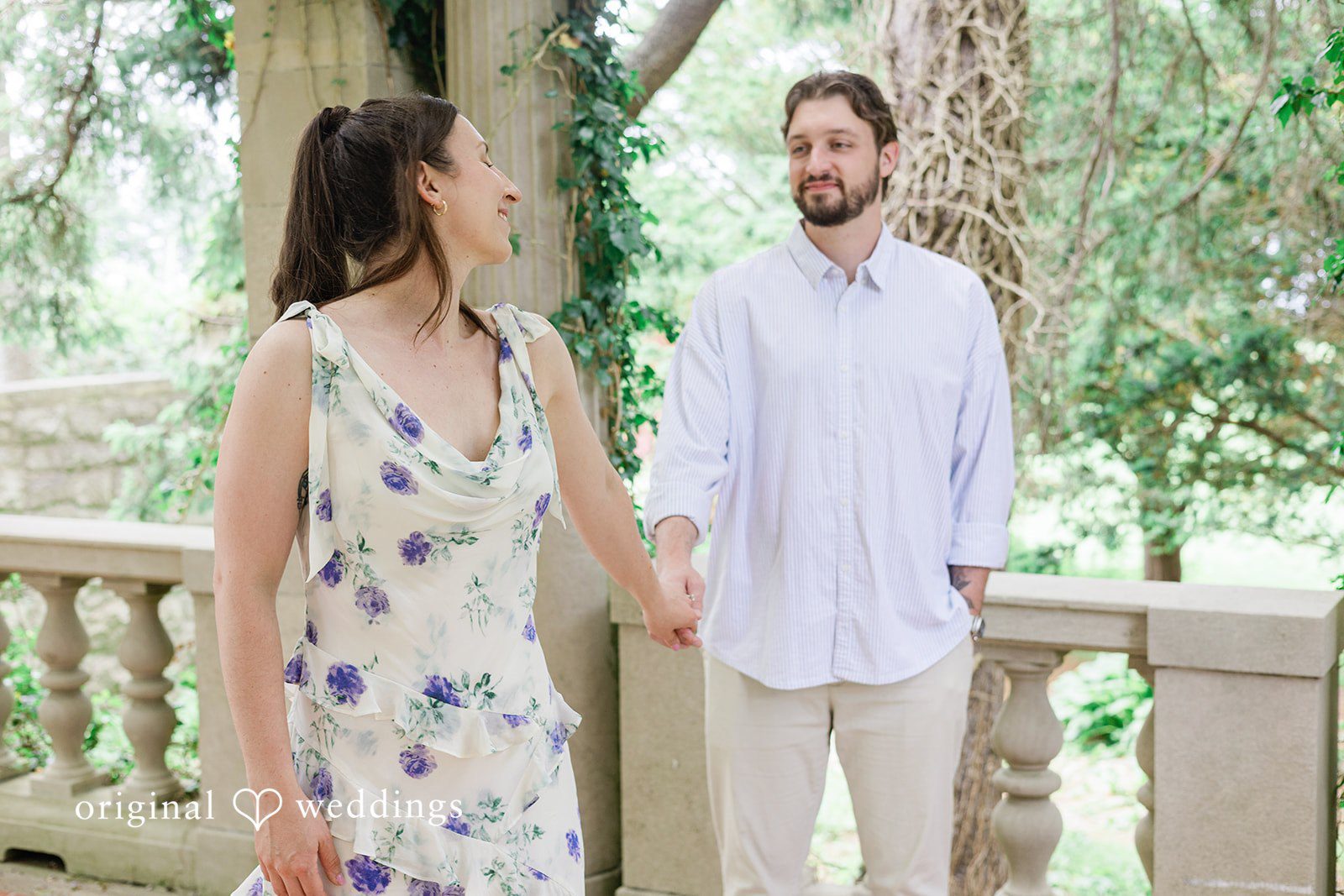 Bride and groom holding hands during their engagement session at Harkness Park