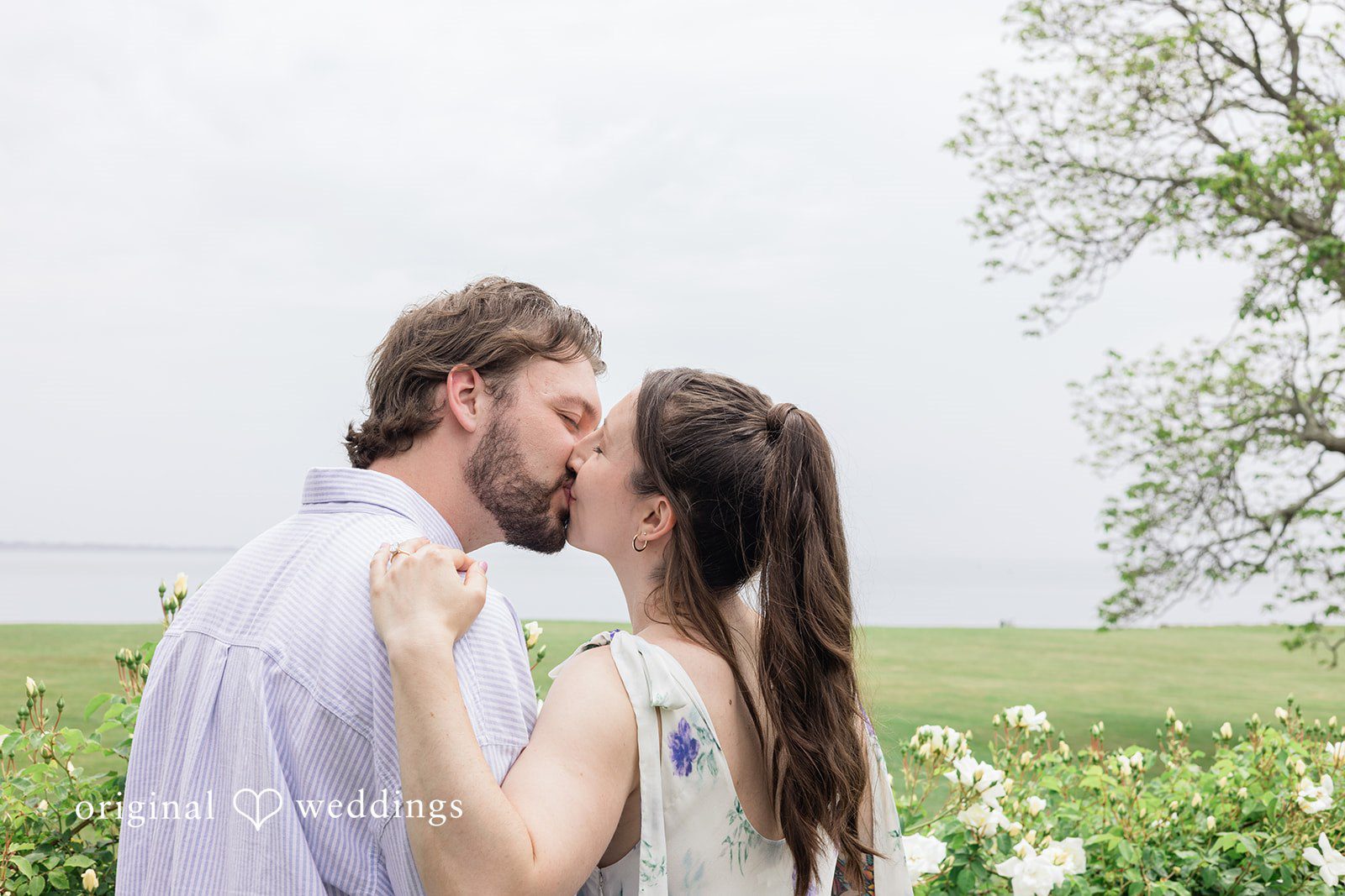 Couple kissing during their engagement session at Harkness Park