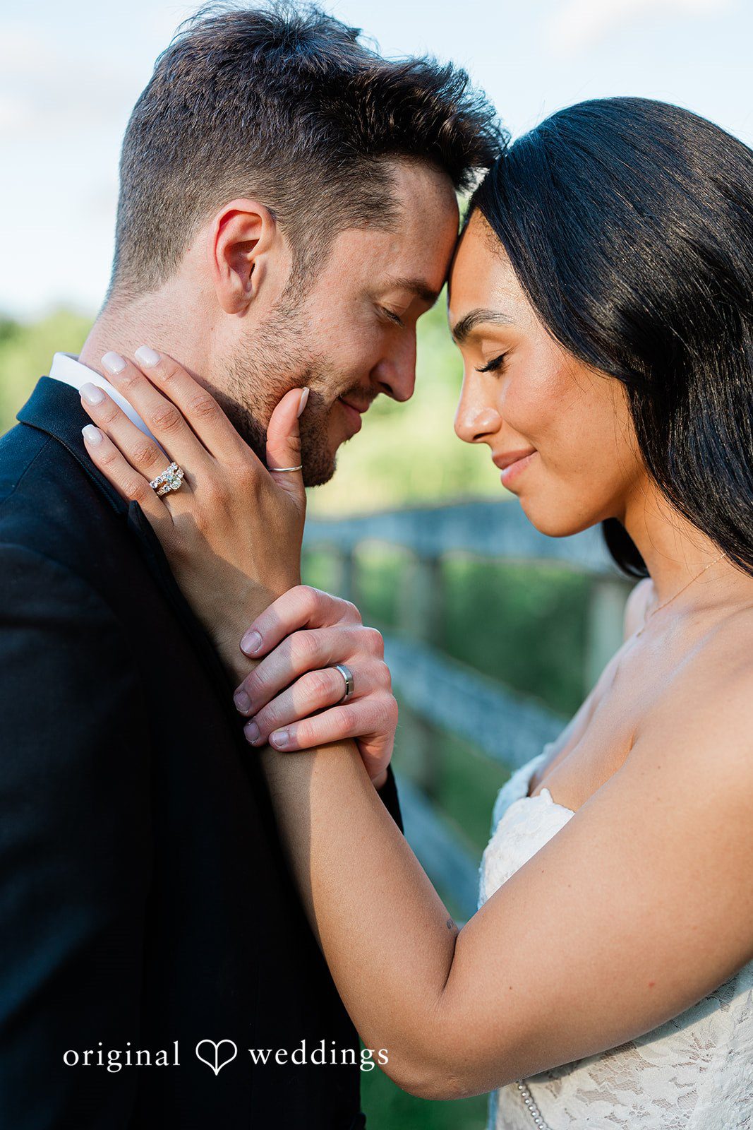 Bride and groom posing with their foreheads together at Chicago Backyard