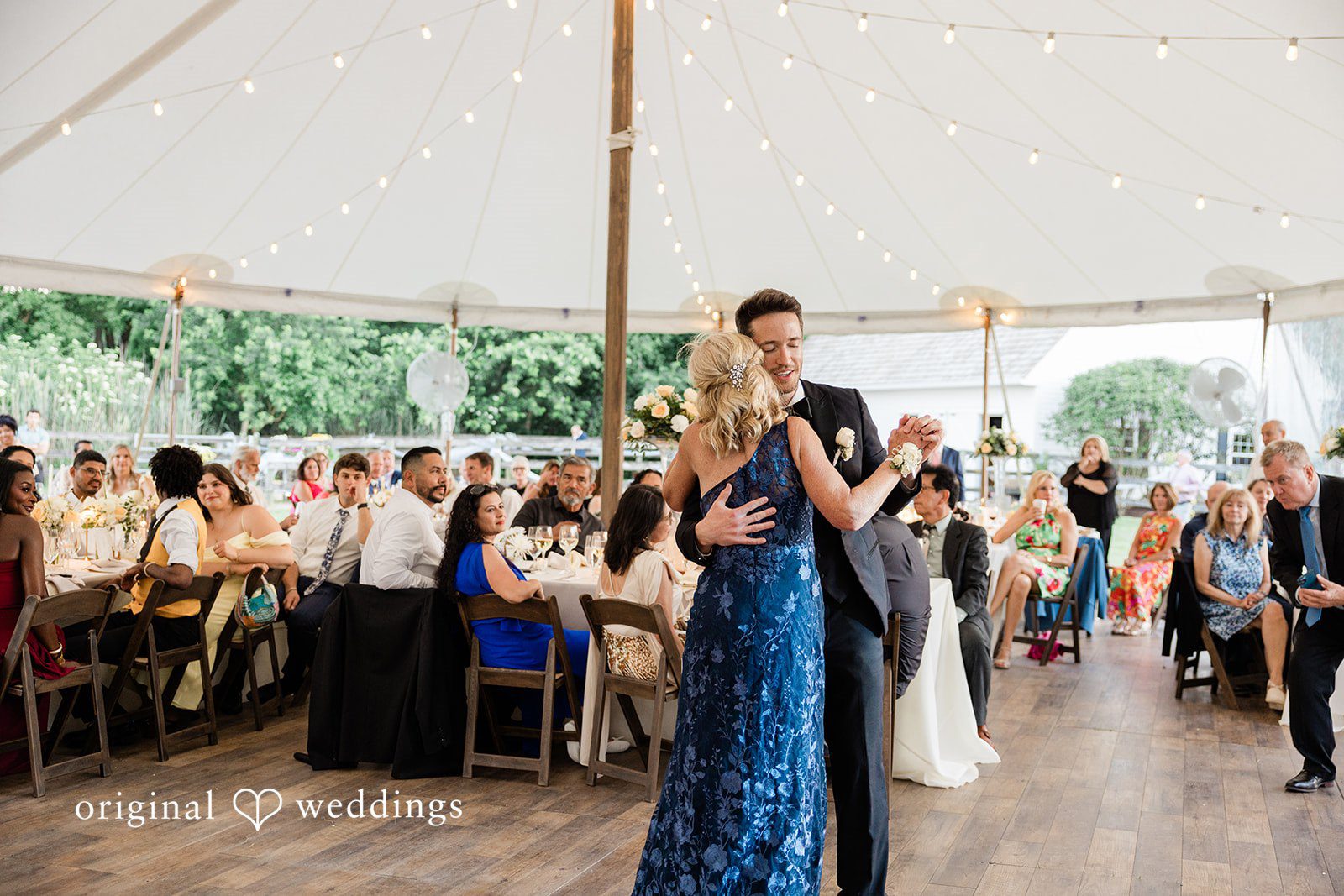 Groom enjoying a dance with someone during the reception at Chicago Backyard