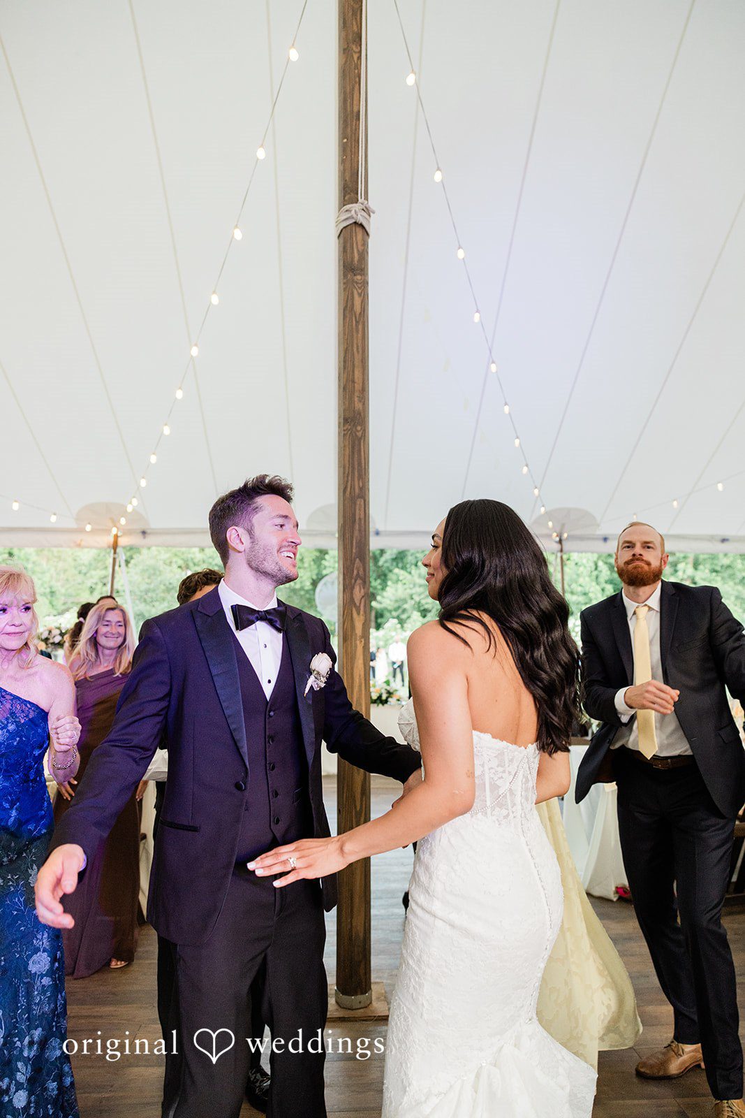 Bride and groom dancing together during the reception at Chicago Backyard