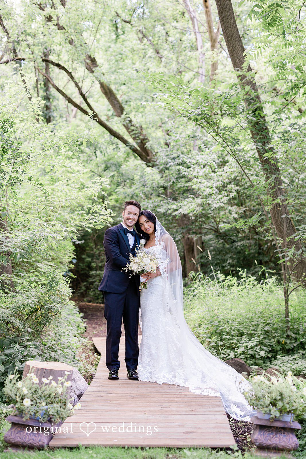 Bride and groom posing together with smiles at Chicago Backyard