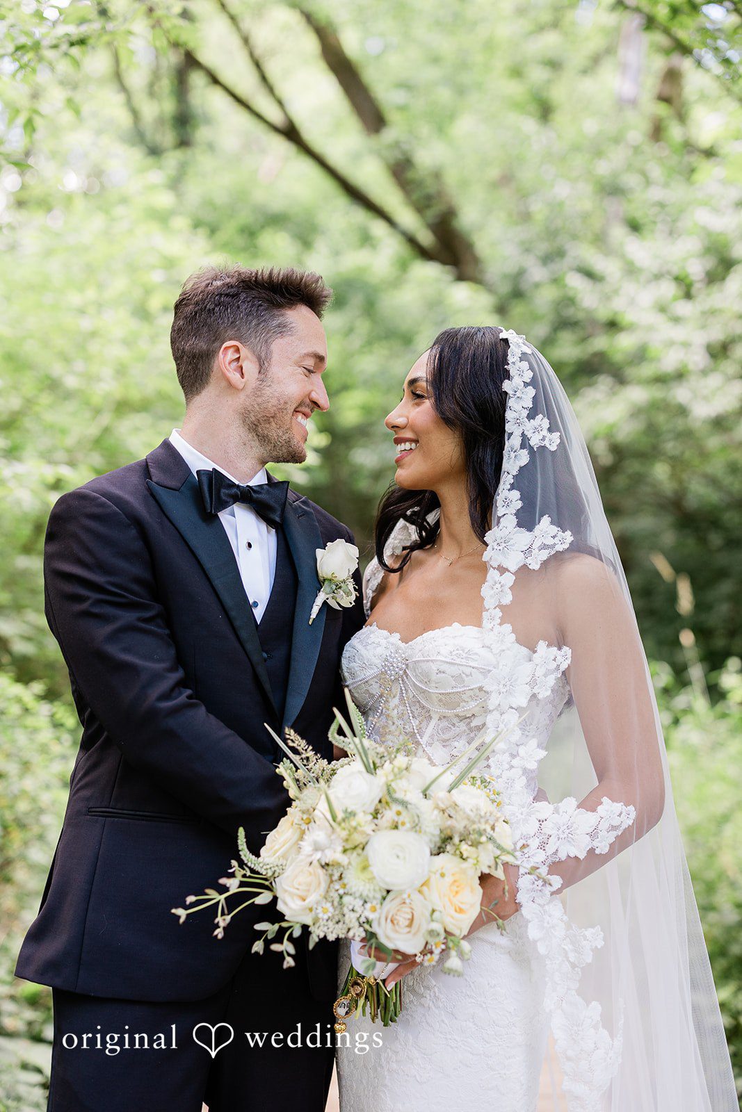 Couple looking at each other with smiles at Chicago Backyard