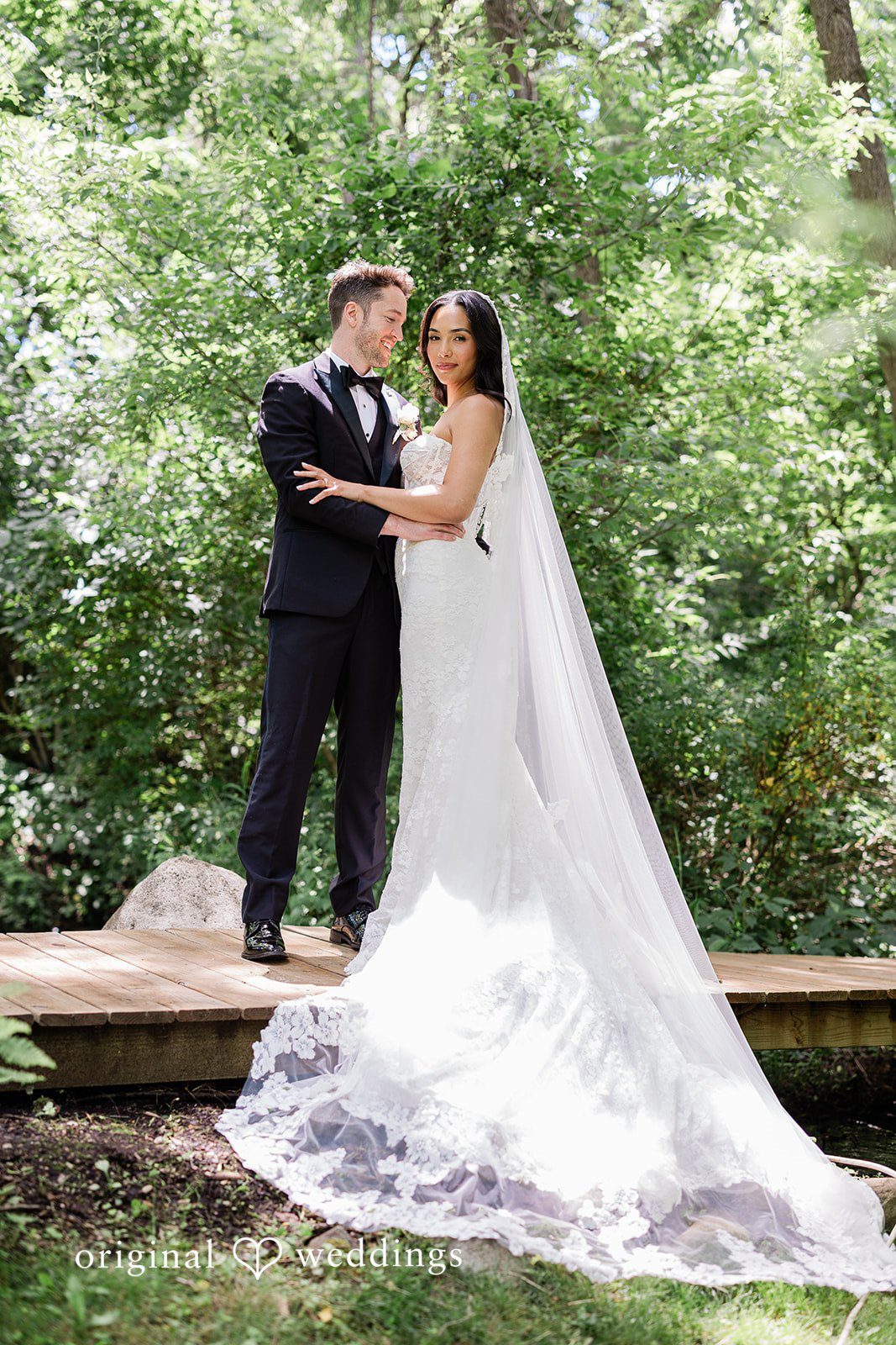 Bride and groom posing together with smiles at Chicago Backyard