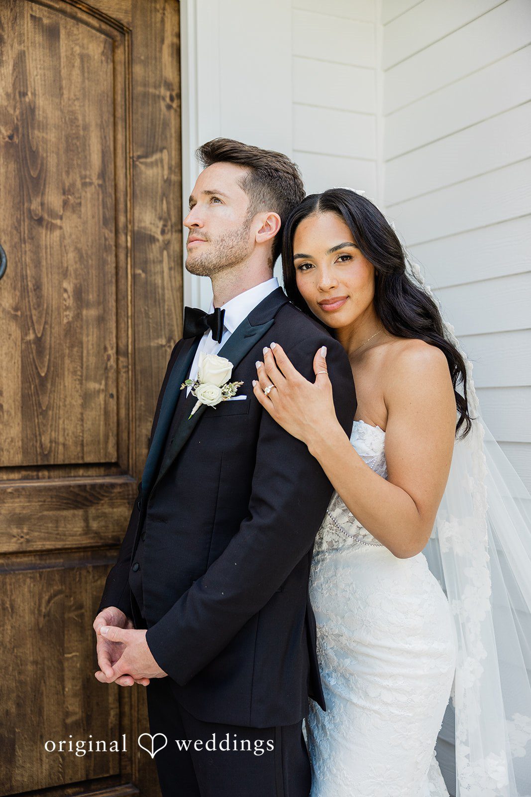 Bride hugging the groom from behind at Chicago Backyard