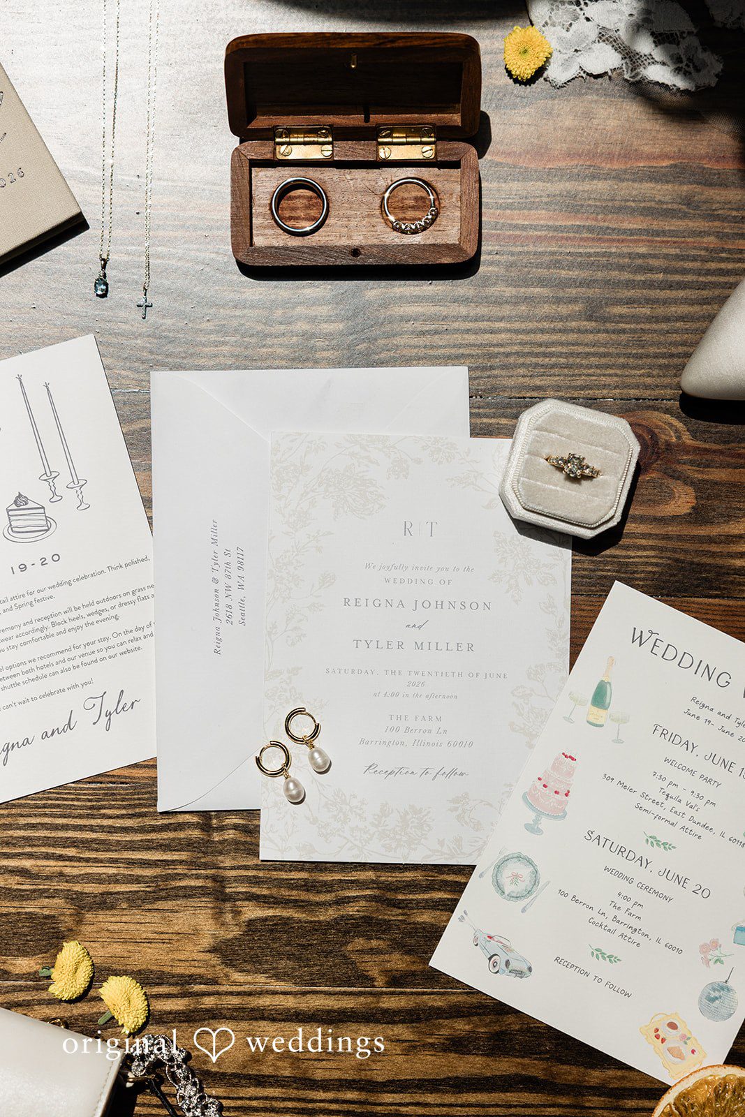 Wedding earings and rings  placed on the invitation card with bridal accessories at Chicago Backyard