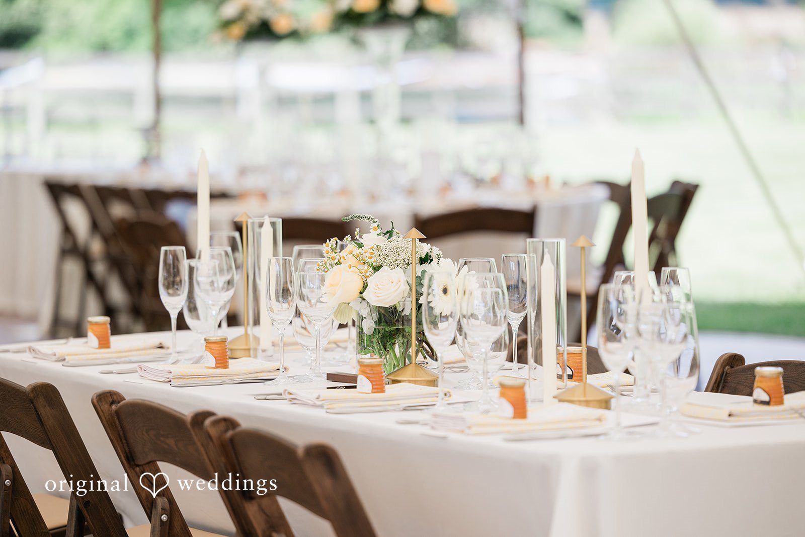 Center table decorated with flowers and glass vases at Chicago Backyard