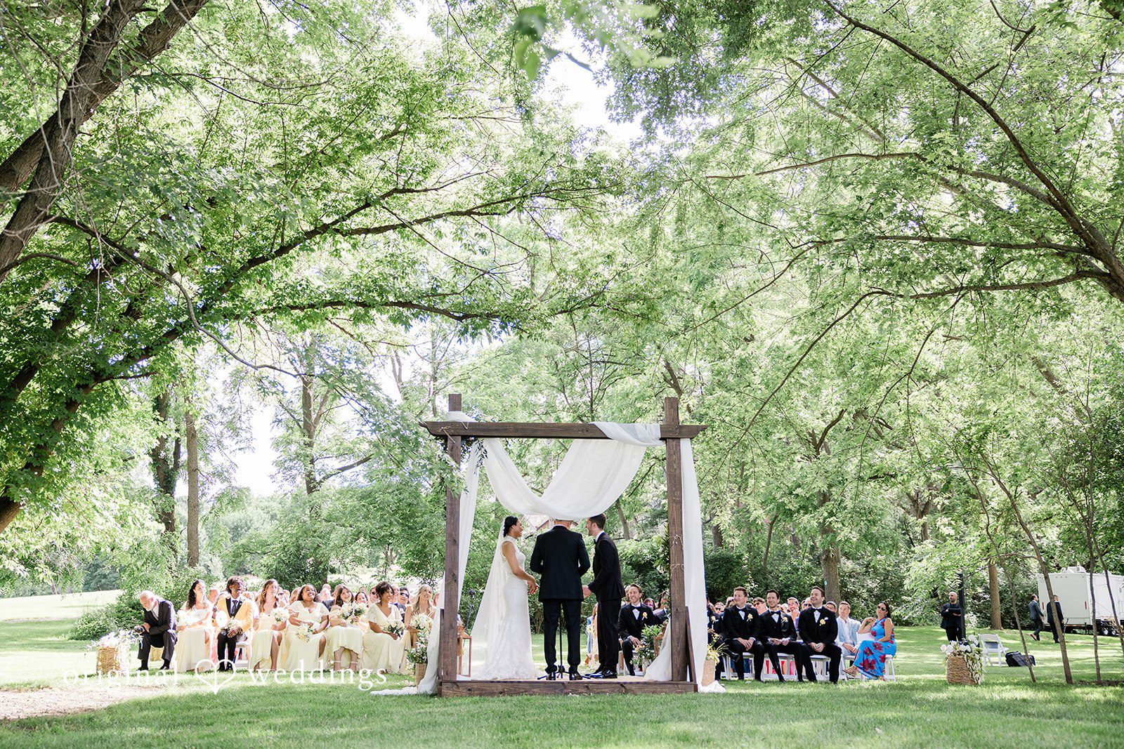 Couple standing before the priest at Chicago Backyard
